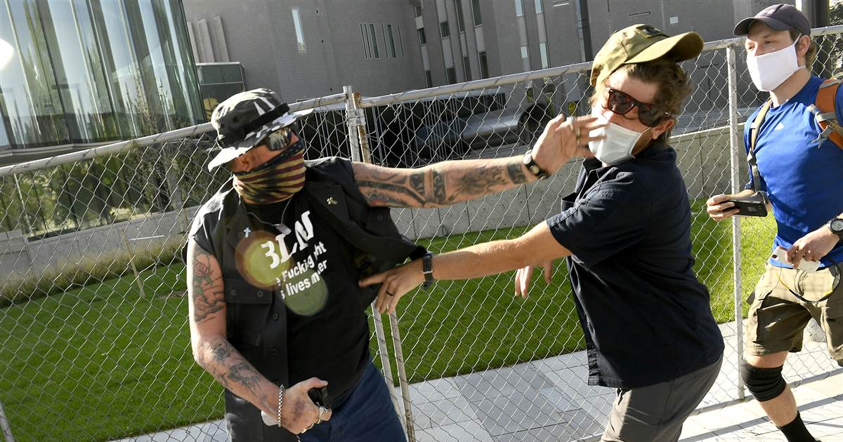 Security guard faces second-degree murder charge after killing at dueling protests in Denver