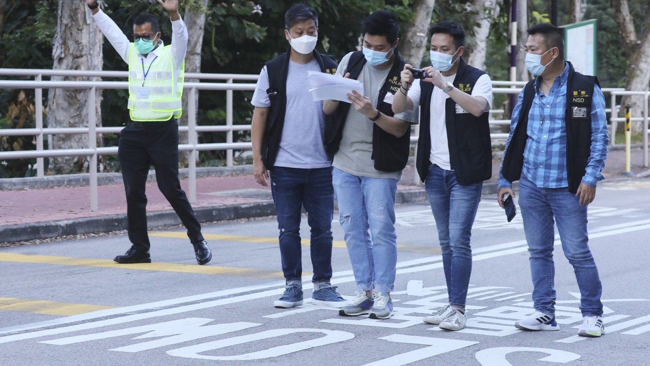 Hong Kong’s national security police gather evidence at university campus after student protesters chanted independence slogans