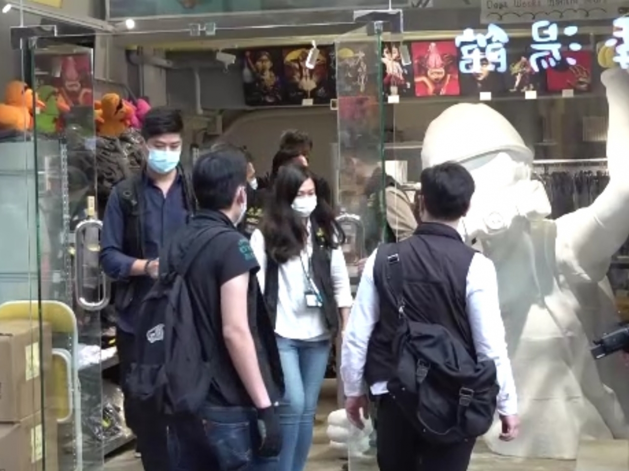 National security officers search kidswear shop