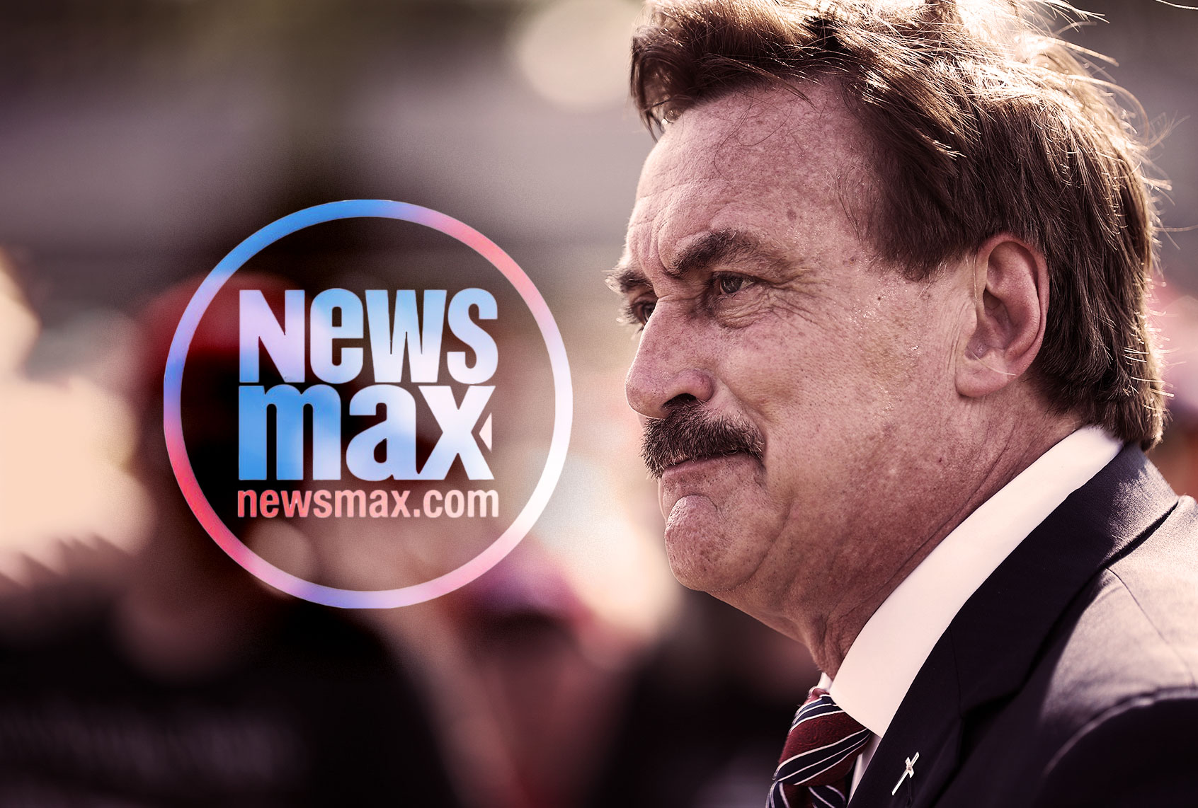 Newsmax sends reporter to heckle Fox News for not airing Mike Lindell’s wild “cyber symposium” ad