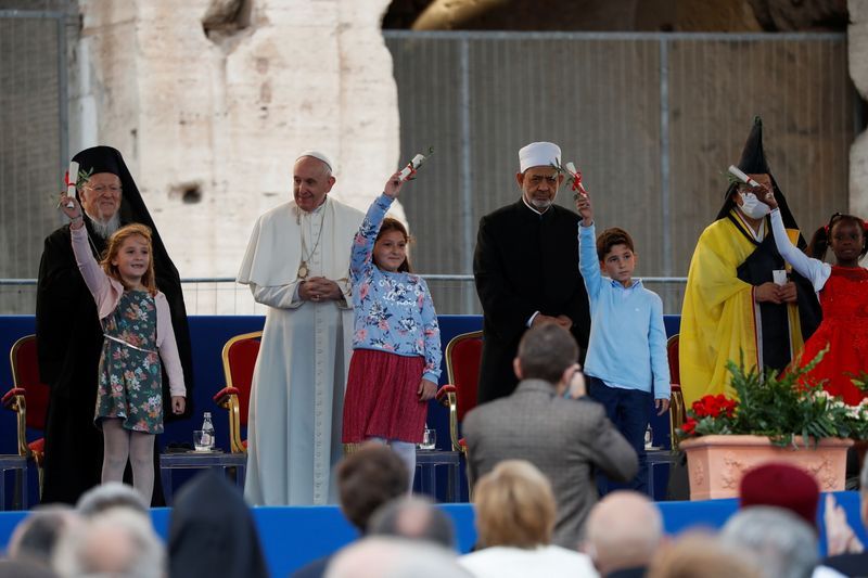 Pope, at peace meeting with Merkel, says divert arms money for food, vaccines