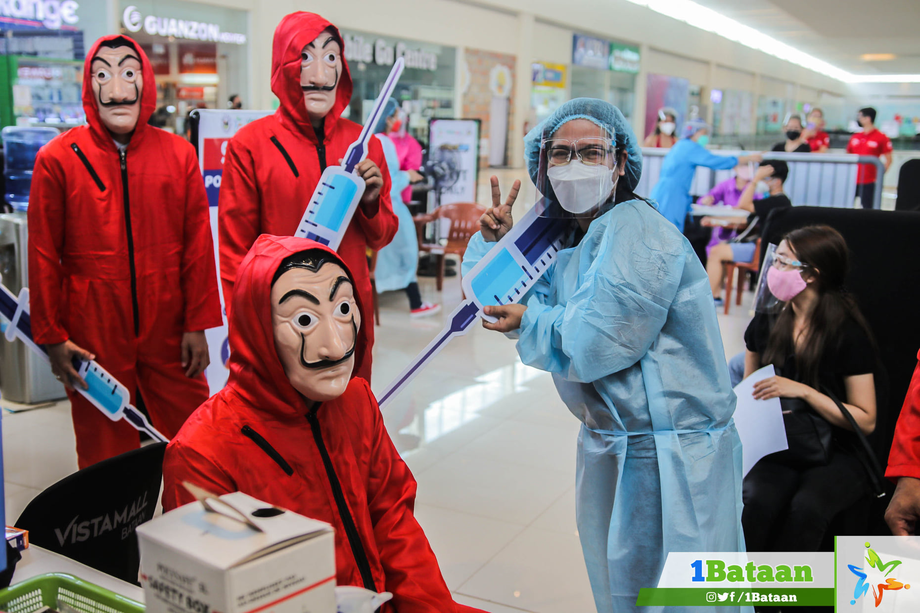 Volunteers at Bataan vaccination site trade PPEs for ‘Money Heist’ costumes